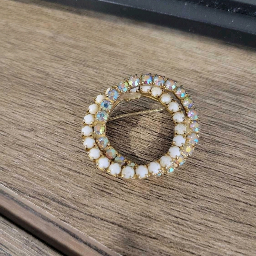 Circle pin milk glass and aurora borealis